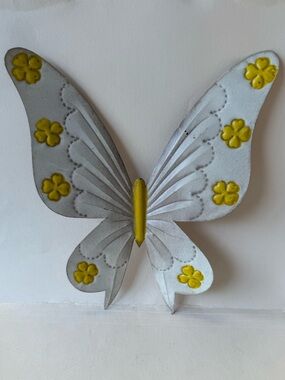 Vintage Mexican Metal Tin Butterfly Wall Art in Beige with Yellow Flowers.